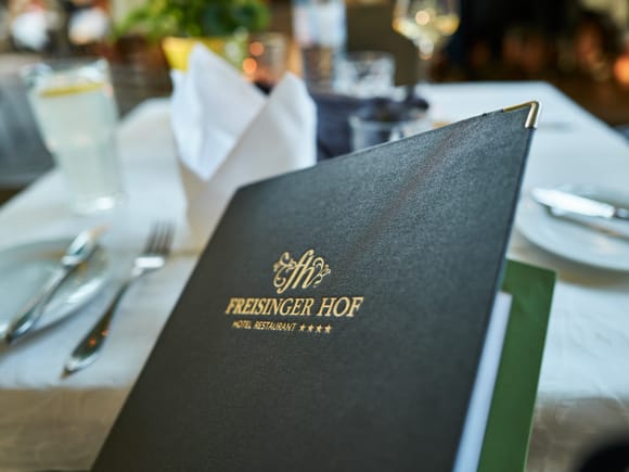 Freisinger Hof menu on a set table.