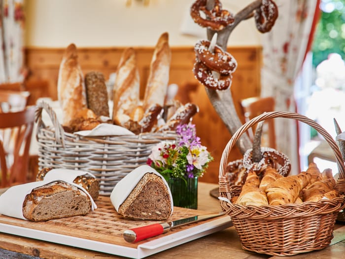 Fresh bread selection with baguettes, pretzels and croissants.